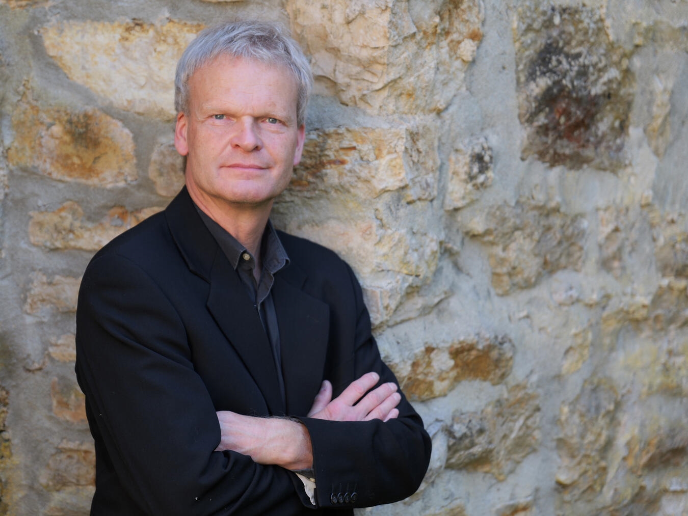 "Andreas Puttkammer, erfahrener Dozent, lächelnd bei Vortrag, Foto von Puttkammer/TIK Emmerich"