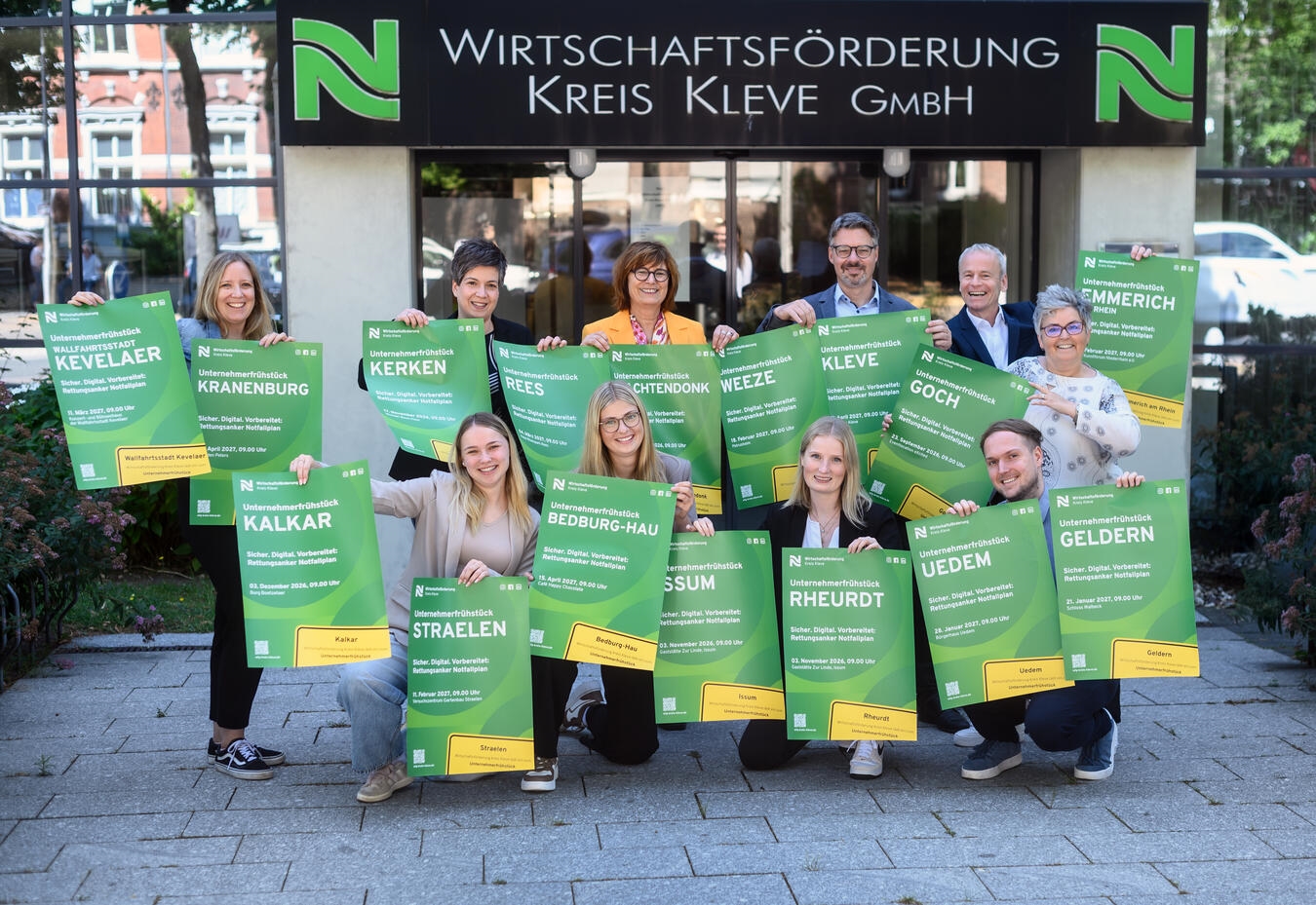 "Wirtschaftsförderung Kreis Kleve Team bei Unternehmerfrühstück, lächelnd, 2026/2027 Planung, Foto von Markus van Offern"