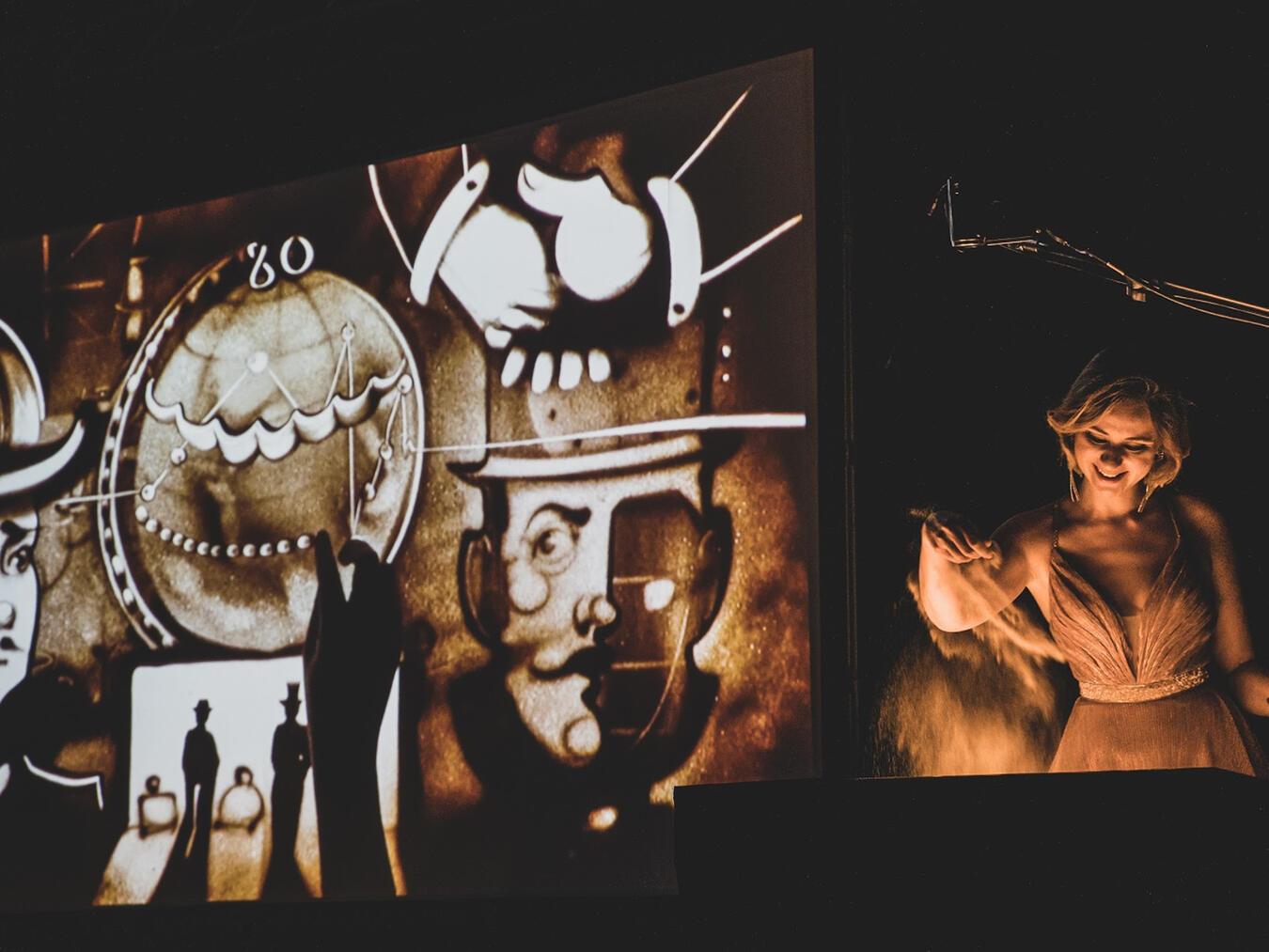 Sandmalerei live mit der Queen of Sands „In 80 Tagen um die Welt“ lautet der Titel der Show, mit der Irina Titova, die „Queen of Sand“, am 11. April 2025 im Bühnenhaus Kevelaer gastiert. Foto: Hans Eder